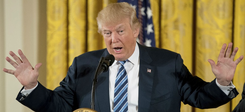 President Donald Trump speaks during a White House senior staff swearing in ceremony.