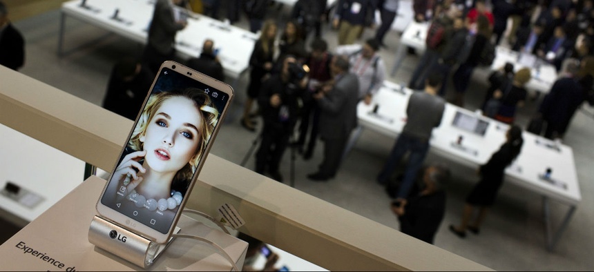 People crowd at the LG stand during the Mobile World Congress wireless show in Barcelona, Spain, Monday, Feb. 27, 2017.