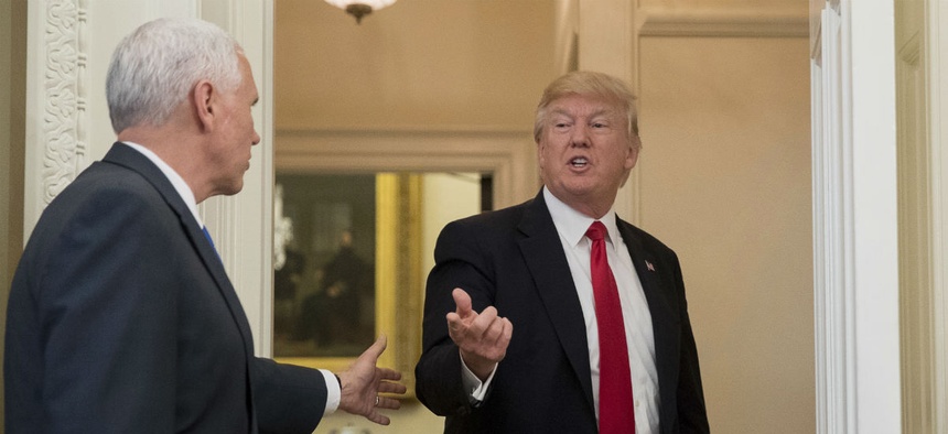 Vice President Mike Pence, left, and President Donald Trump in the Oval Office of the White House, in Washington, March 31, 2017