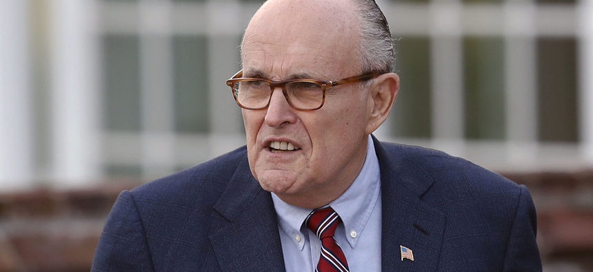 Former New York Mayor Rudy Giuliani arrives at the Trump National Golf Club Bedminster clubhouse, Sunday, Nov. 20, 2016.