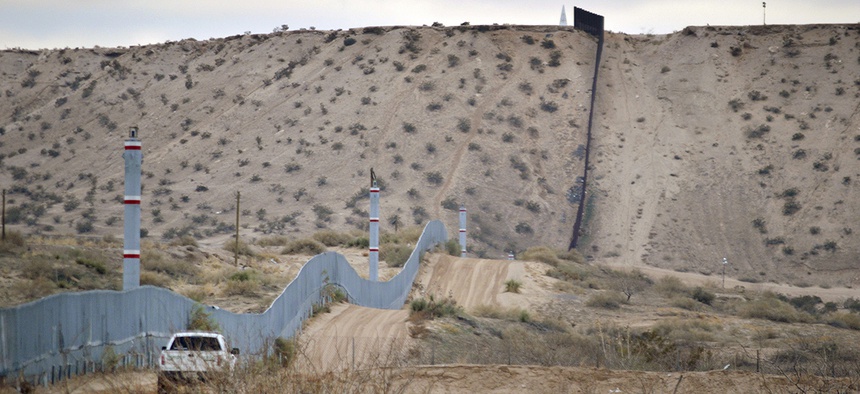 A U.S. Border Patrol agent drives near the U.S.-Mexico border fence in Sunland Park, New Mexico.