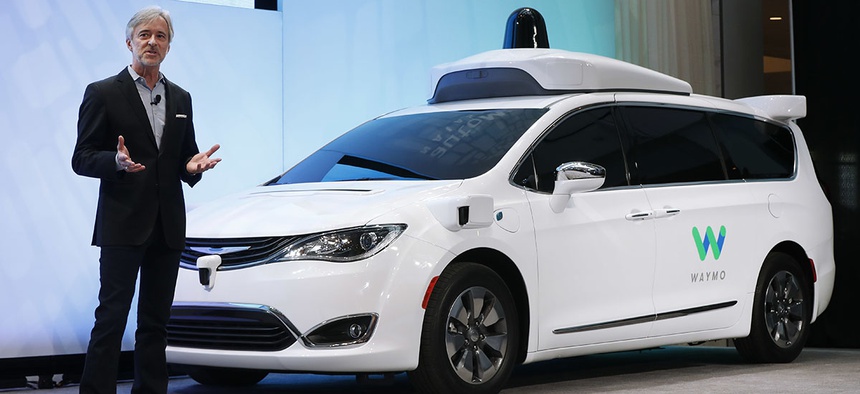 John Krafcik, CEO of Waymo, the autonomous vehicle company created by Google's parent company, Alphabet, introduces a Chrysler Pacifica hybrid outfitted with Waymo's own suite of sensors and radar.