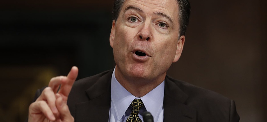 Then-FBI Director James Comey testifies on Capitol Hill in Washington.