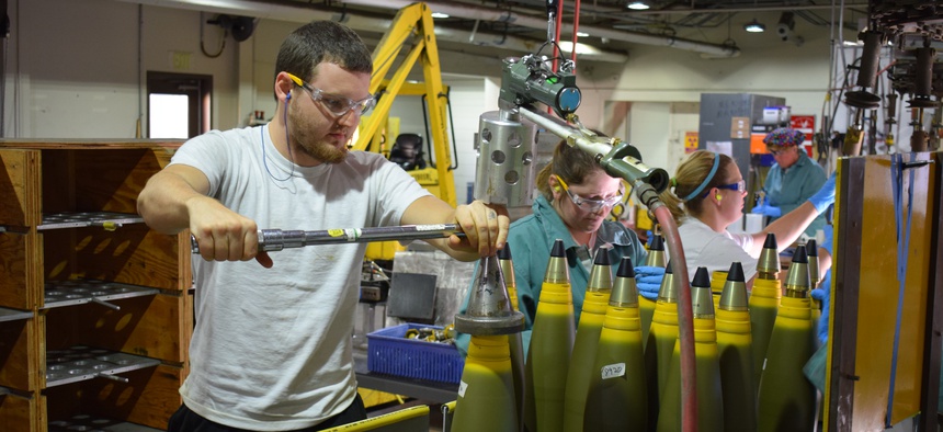 A Crane Army Ammunition Activity explosives operator torques the fuse to a 5"/54 projectile body during 2017 production in Crane, Indiana.