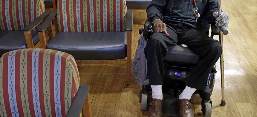 A U.S. Army veteran waits for prescription drugs in a pharmacy waiting room inside the Fayetteville Veterans Affairs Medical Center in Fayetteville, N.C.