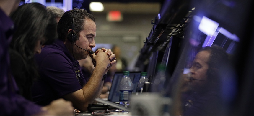 IO manager Luis Morales monitors the status of NASA's Cassini spacecraft in mission control at NASA's Jet Propulsion Laboratory, Friday, Sept. 15, 2017, in Pasadena, Calif.