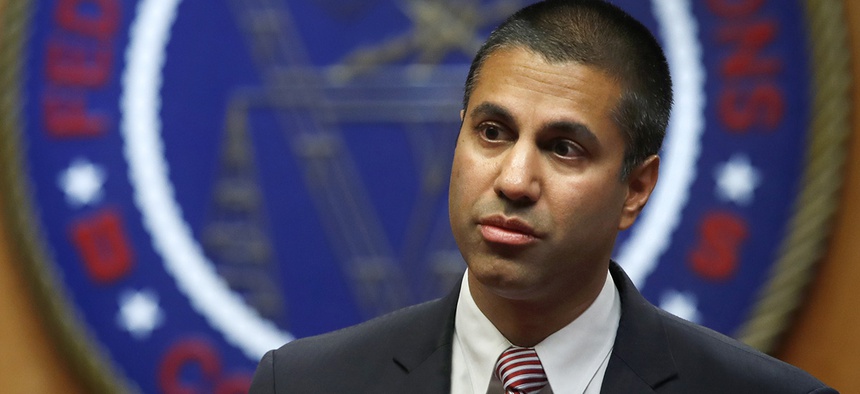 FCC Chairman Ajit Pai arrives for an FCC meeting where they will vote on net neutrality, Thursday, Dec. 14, 2017.