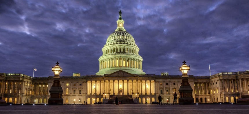 The U.S. Capitol Building as night falls in Washington, Sunday, Jan. 21, 2018 and Congress continues to negotiate during the second day of the federal government shutdown.