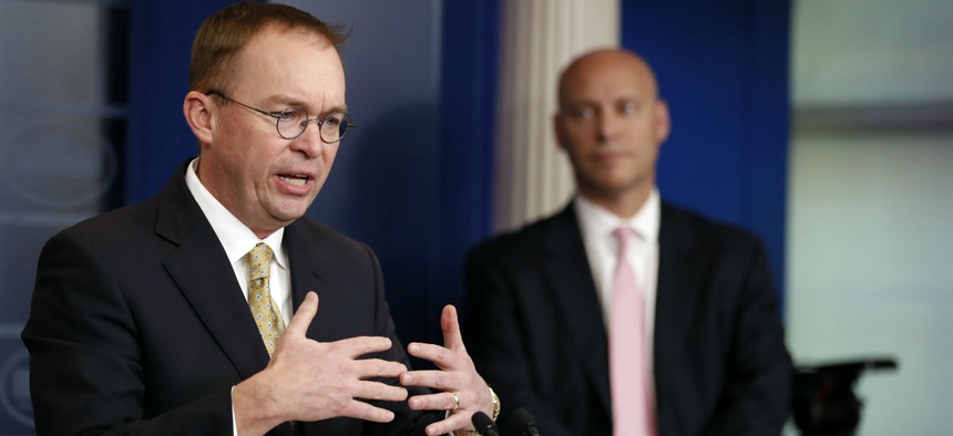 Director of the Office of Management and Budget Mick Mulvaney, left, speaks as Marc Short, White House director for legislative affairs, stands nearby during a press briefing at the White House, Saturday, Jan. 20, 2018.