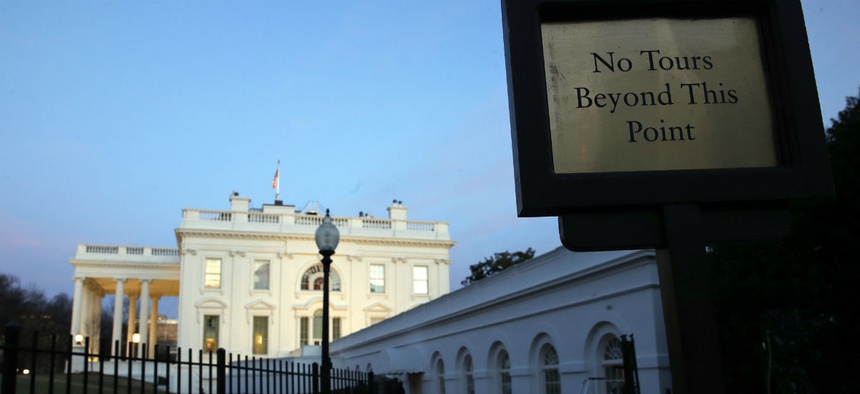 The White House is seen at sunset Saturday, Jan. 20, 2018, in Washington.