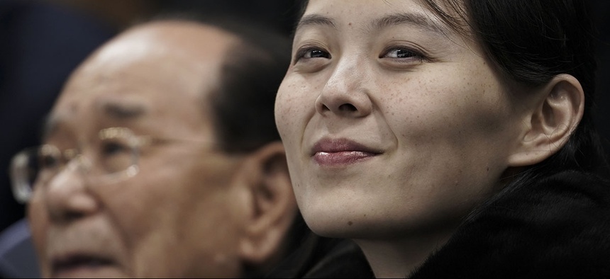 Kim Yo Jong, sister of North Korean leader Kim Jong Un, right, and North Korea's nominal head of state Kim Yong Nam watch an Olympic hockey game.