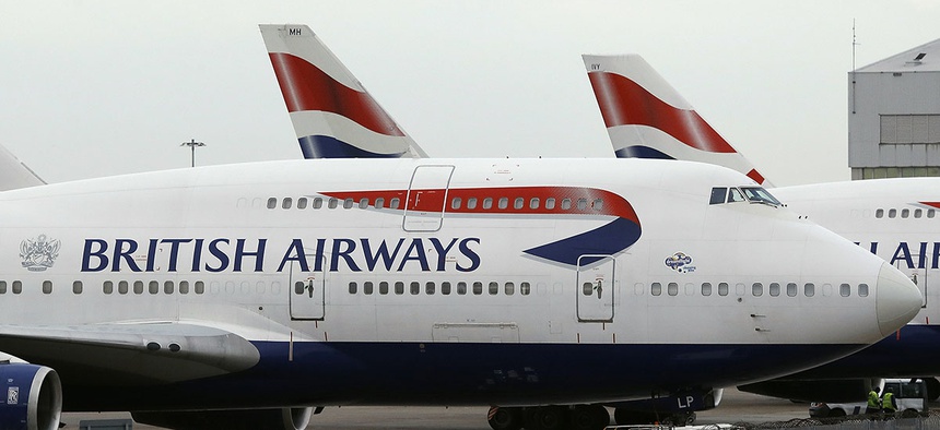 British Airways planes are parked at Heathrow Airport.