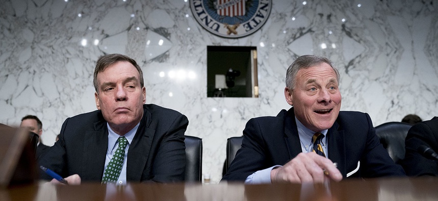 Senate Intelligence Chairman Richard Burr, R-N.C., right, accompanied by Committee Vice Chairman Mark Warner, D-Va.