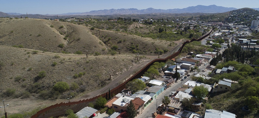 This photo made with a drone, shows the U.S. Mexico border fence as it cuts through the two downtowns of Nogales, Ariz.