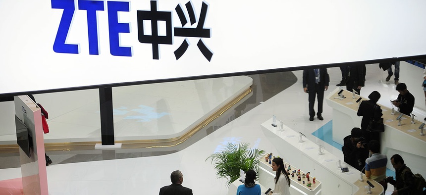 People gather at the ZTE booth at the Mobile World Congress.