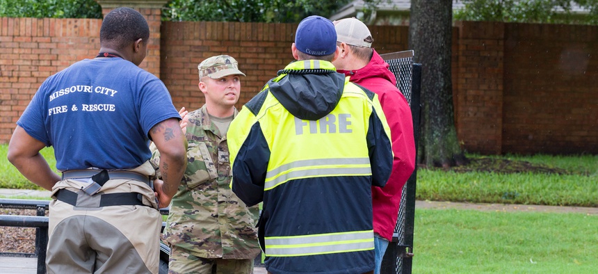 Texas National Guard and first responders working together to assist with emergency operations. Heavy rains from hurricane Harvey caused many floods near Houston Aug. 29, 2017.