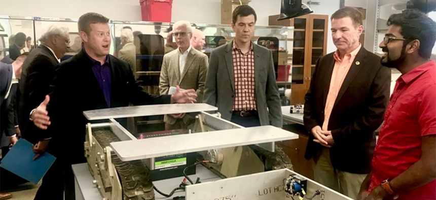 U.S. Army Undersecretary Ryan McCarthy, Army Vice Chief of Staff Gen. Jim McConville a University of Texas at Austin 3D printing lab, Thursday, August 23, 2018.