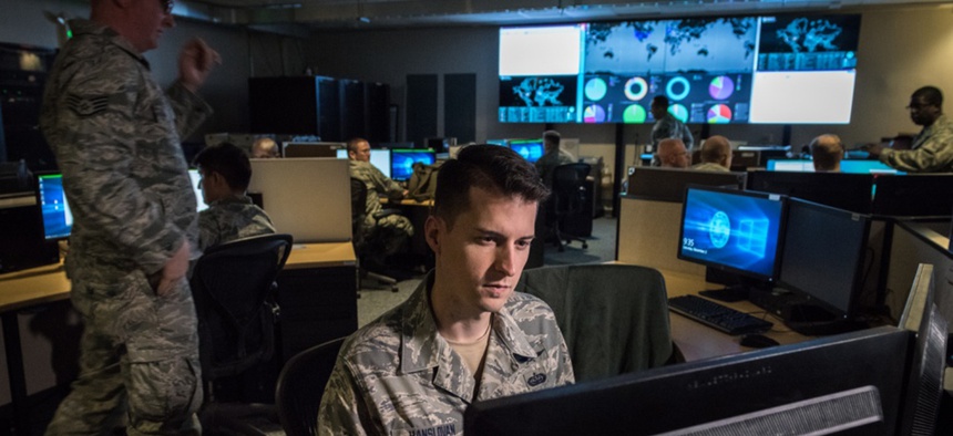 Tech. Sgt. Kyle Hanslovan, a cyber-warfare specialist serving with the 175th Cyberspace Operations Group of the Maryland Air National Guard, works in the Hunter's Den at Warfield Air National Guard Base, Middle River, Md., Dec. 2, 2017.
