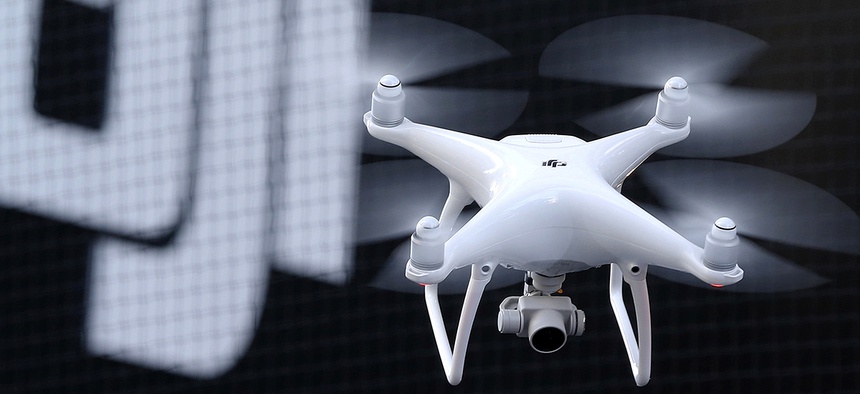 A Phantom 4, developed by consumer-drone maker DJI, flies during its demonstration flight in Tokyo, Thursday, March 3, 2016.