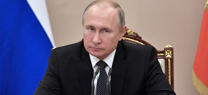 Russian President Vladimir Putin chairs a Security Council meeting in the Kremlin in Moscow, Russia, Monday, Dec. 17, 2018.