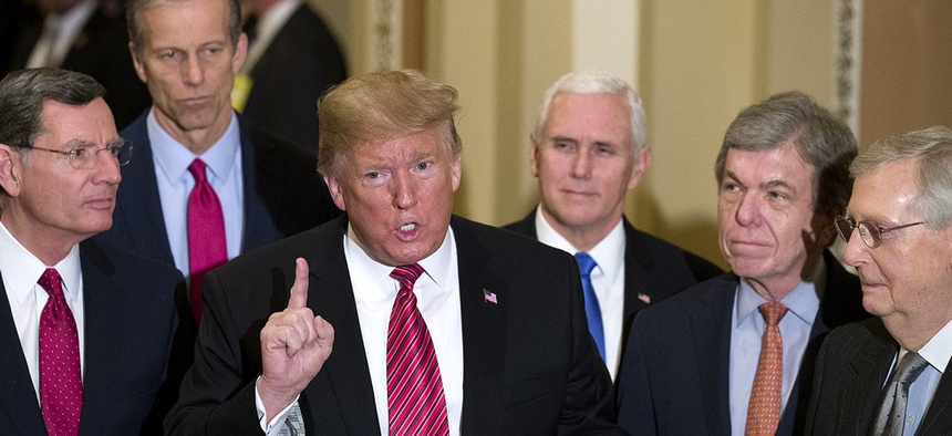 Trump speaks while departing after a Senate Republican Policy luncheon, on Capitol Hill in Washington, Wednesday, Jan. 9, 2019.