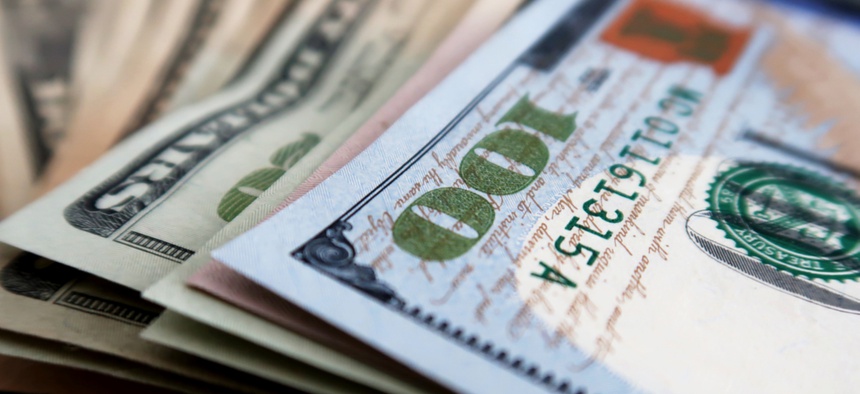 A stack of dollar bills of varying amounts