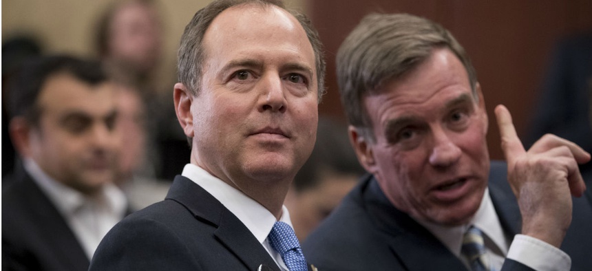 Rep. Adam Schiff, left, speaks with Sen. Mark Warner at an event marking 100 days since the death of Jamal Khashoggi on Capitol Hill Jan. 10.