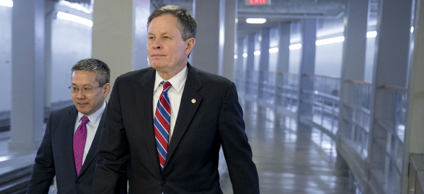 Sen. Steve Daines, R-Mont., walks through the Senate subway on Capitol Hill in Washington Jan. 9.